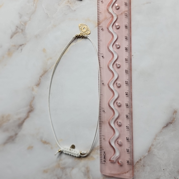 14k gold evil eye hamsa bracelet with fabric cord made in Italy - Picture 5 of 6